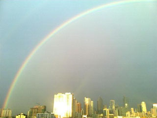 A rainbow over Mandaluyong's skyline Wednesday afternoon brings hopes of calmer weather. Eric Antonio A rainbow over Mandaluyong's skyline Wednesday afternoon brings hopes of calmer weather. <b>Eric Antonio</b>