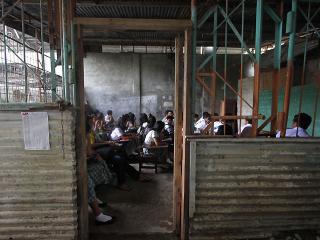 Davao students hold class in stockrooms, covered courts