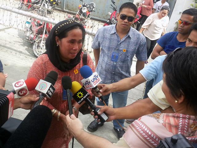 Jennah Mangudadatu-Lumawan, the sister of Maguindanao Gov. Esmael Mangudadatu breaks into tears on Wednesday after the arraignment of Zaldy Ampatuan in Taguig City where he pleaded 'not guilty' to charges of masterminding the Maguindanao Massacre on Nov. 23, 2009. 