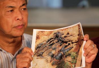 Malaysian top official shows photo of supposed Filipino fatalities