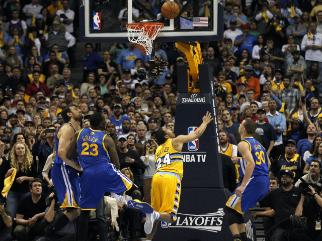 The Denver Nuggets' Andre Miller shoots during the second half of